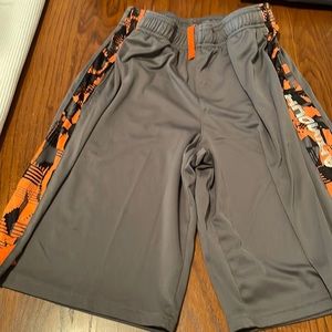 Under armour youth large shorts, gray with orange